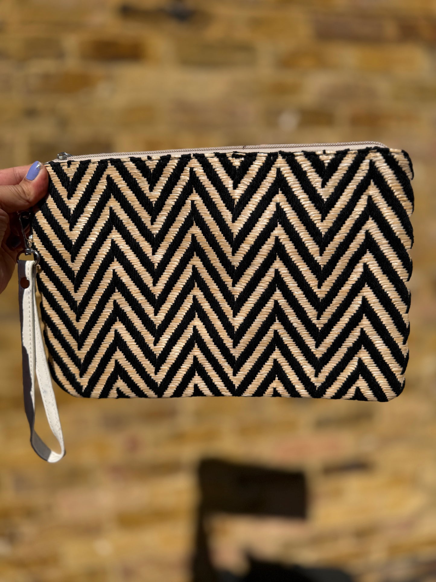 Luxe woven and straw clutch bag
