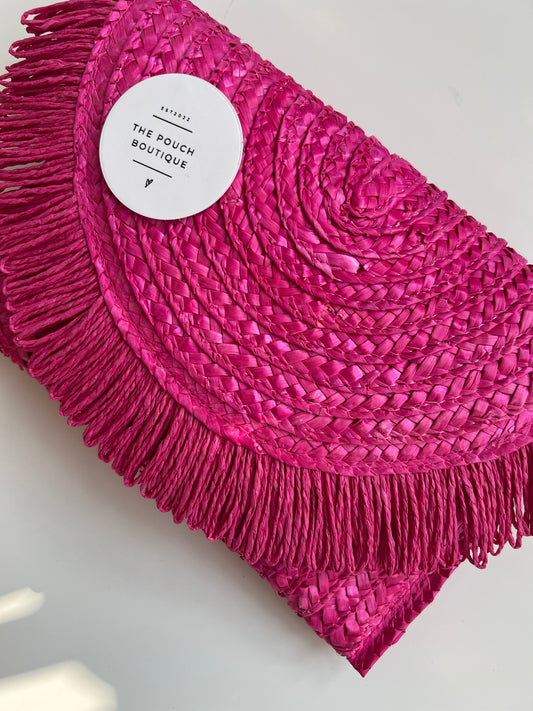 Pink tassle clutch bag